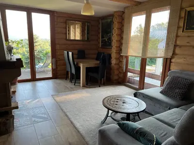 a living room with a couch and a table at Ranczo Borówka in Łapanów