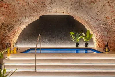 a swimming pool in a tunnel with stairs at Muse by StayLab in Kraków