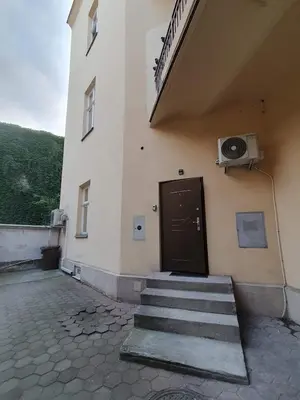 a building with a door and stairs in front of it at L-2 Kraków Center Studio O&P ApartFamily in Kraków