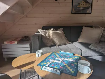 a chess board on a table in a living room at Babia Ostoja - domek z balią i sauną in Zawoja