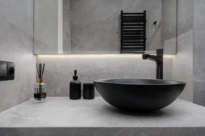 a bathroom with a black bowl sink in a counter at Apartament w Centrum Krakowa 106 in Kraków