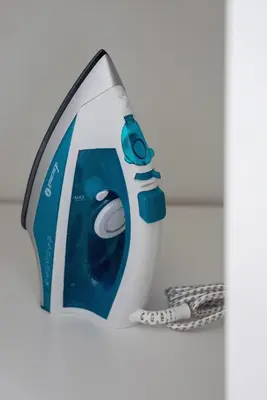 a close up of a blue and white shower head at Comfy & Bright Studio Wielicka in Krakow by Noclegi Renters in Kraków