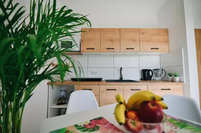 a bowl of fruit on a table in a kitchen at Noclegi u Szymonków Zator Przeciszów in Zator