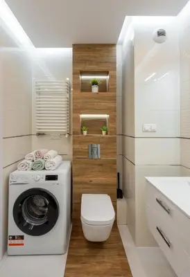 a bathroom with a washing machine and a toilet at Apartment BLUE PEARL 2 rooms Down Town 4 persons balcony free parking in Kraków