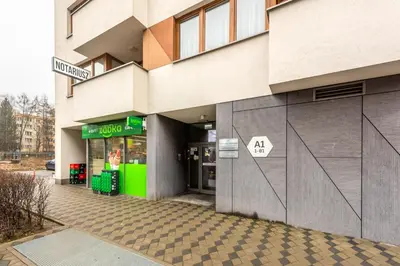 a store front of a building on a street at Apartment BLUE PEARL 2 rooms Down Town 4 persons balcony free parking in Kraków