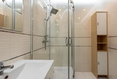 a bathroom with a shower and a sink at Apartment BLUE PEARL 2 rooms Down Town 4 persons balcony free parking in Kraków