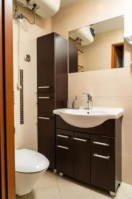 a bathroom with a sink and a toilet at Studio Asnyka Old Town in Kraków