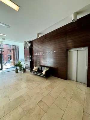 a lobby with a sign that reads angel city at Stylowe studio z parkingiem - 3 minuty od Dworca & Galerii Krakowskiej in Kraków