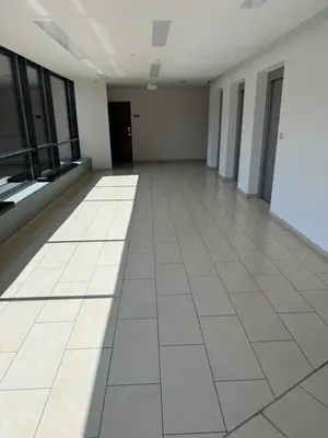 an empty room with a tile floor and windows at Stylowe studio z parkingiem - 3 minuty od Dworca & Galerii Krakowskiej in Kraków