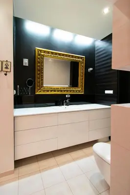 a bathroom with a sink and a mirror at Spacious 3BR apartment with AC in living room, 2 balconies in Kraków