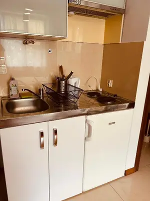 a kitchen with a sink and a counter top at KR Apartament in Kraków