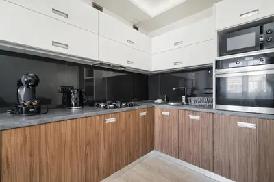 a living room with a table and a couch at Apartament Na Szlaku WAWELOFTS in Kraków