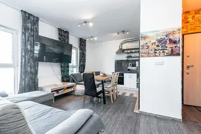 a room with a table and a dining room at Cracovia Apartment in Kraków