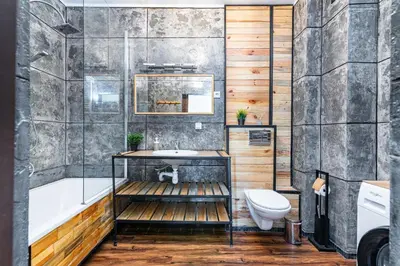 a bathroom with a tub and a sink and a toilet at Cracovia Apartment in Kraków