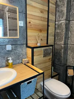 a bathroom with a sink and a toilet at Cracovia Apartment in Kraków