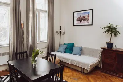 a living room with a couch and a table at Kraków Wawel Zwierzyniecka in Kraków