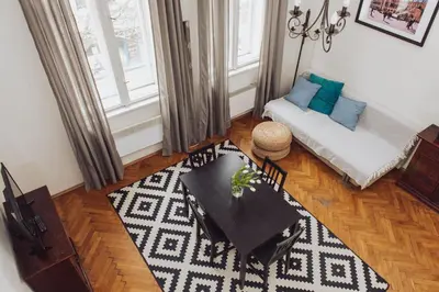 a living room with a couch and a table at Kraków Wawel Zwierzyniecka in Kraków
