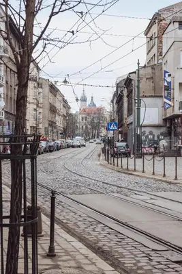 an empty city street with cars parked on the road at Kraków Wawel Zwierzyniecka in Kraków