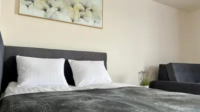 a bedroom with a bed and a picture on the wall at Rising Sun 3 by Housine,pl in Zator