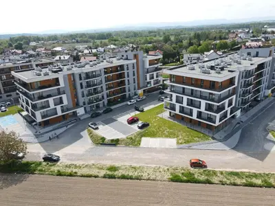 an aerial view of buildings in a city at Rising Sun 3 by Housine,pl in Zator