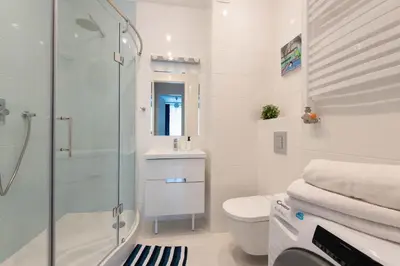 a bathroom with a shower and a toilet and a sink at GROBLE 19 in Kraków