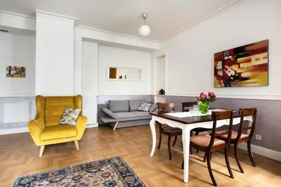 a living room with a table and chairs and a couch at GROBLE 19 in Kraków