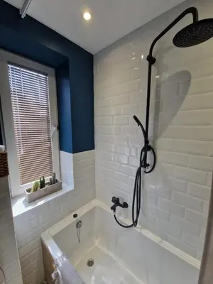 a bathroom with a bath tub with a shower at Stefczyka 119 in Bachowice