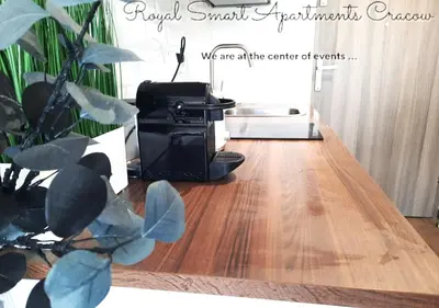 a camera sitting on top of a wooden floor at Royal Smart Apartments Cracow in Kraków