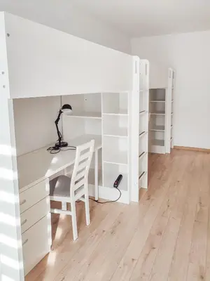 a room with a desk and a bed and a chair at Apartment Szwed-Sniadowskiej Residence in Kraków
