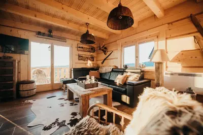 a living room with a couch and a table at Górskie Tarasy in Rabka