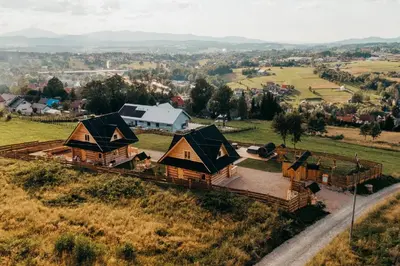 an aerial view of a village with cottages at Górskie Tarasy in Rabka
