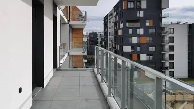 a balcony with a view of some buildings at Novum City Center, Sun & Snow in Kraków