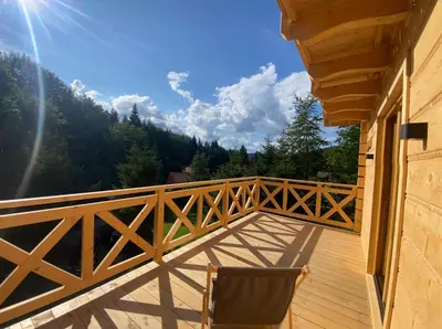 a balcony with a view of the mountains at Babiogórskie klimaty in Zawoja
