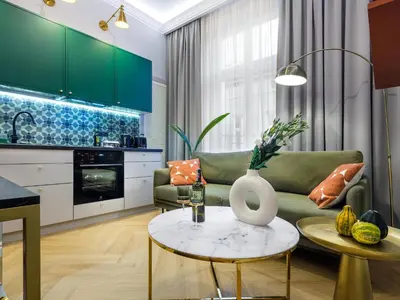 a living room with a couch and a table at GREEN CHILL Apt Old Town & Wawel Hill by Vistula River - by Homelike Krakow in Kraków