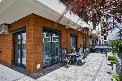 a patio with chairs and a table in front of a building at Pankrac 2 by Housine in Zator