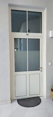 a large cabinet with glass doors in a room at JUWEL Apartments Kraków z widokiem na Wawel ap 31 in Kraków