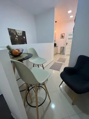 a room with two chairs and a table in a room at Salt INN Apartments No 1 in Wieliczka