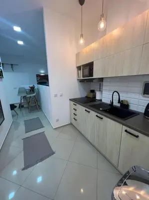 a kitchen with a sink and a counter top at Salt INN Apartments No 1 in Wieliczka