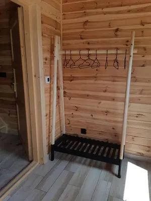 a sauna with wooden walls and a wooden floor at Domki na granicy - Kocoń in Jeżowski Dział