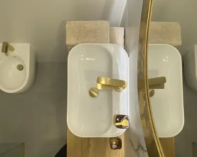 a bathroom with two white urinals in a room at Comfort Garden View Apartment in Kraków