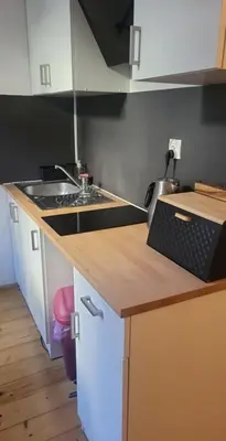 a kitchen with a sink and a counter top at ViP Apartment Krakow in Kraków