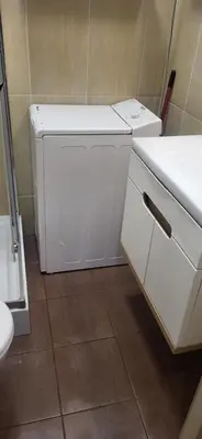 a white washer and dryer in a bathroom at ViP Apartment Krakow in Kraków