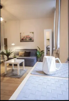 a living room with a couch and a table at ViP Apartment Krakow in Kraków