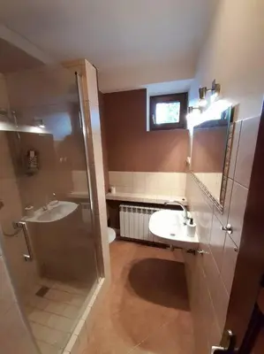 a bathroom with a shower and a sink and a toilet at Bronowice- parter domu in Kraków