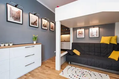 a large bedroom with a large bed with two pillows at Zulu Apartments Old Town in Kraków