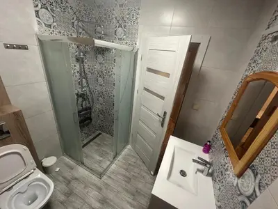 a bathroom with a shower and a toilet and a sink at Domek w Koszarawie Bystrej in Koszarawa