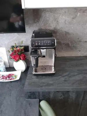 a black sewing machine sitting on a table with flowers at Good rest in 52 in Zator