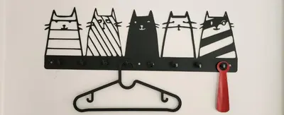 a cut out picture of black cats and a pair of scissors at Nature in Kraków