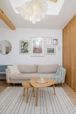 a living room with a couch and a table at Unique Air-conditioned Apartment Dietla Cracow by Noclegi Renters in Kraków