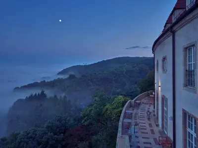 a building with a view of a mountain at Zinar Castle in Kraków